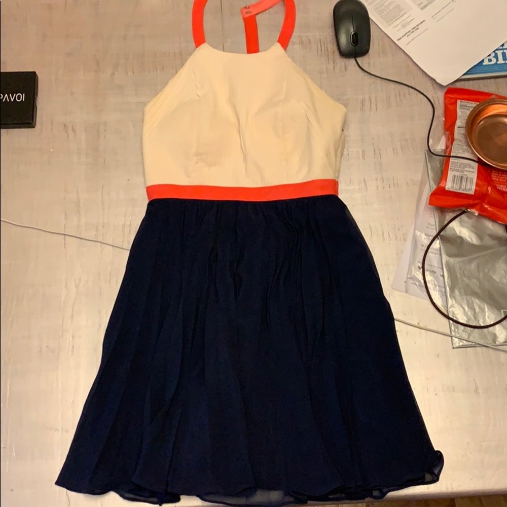 Cream, pink, and navy dress with pleats